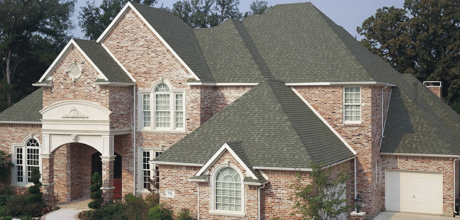 Beige house with Charcoal roof using Heritage Oxford Grey
